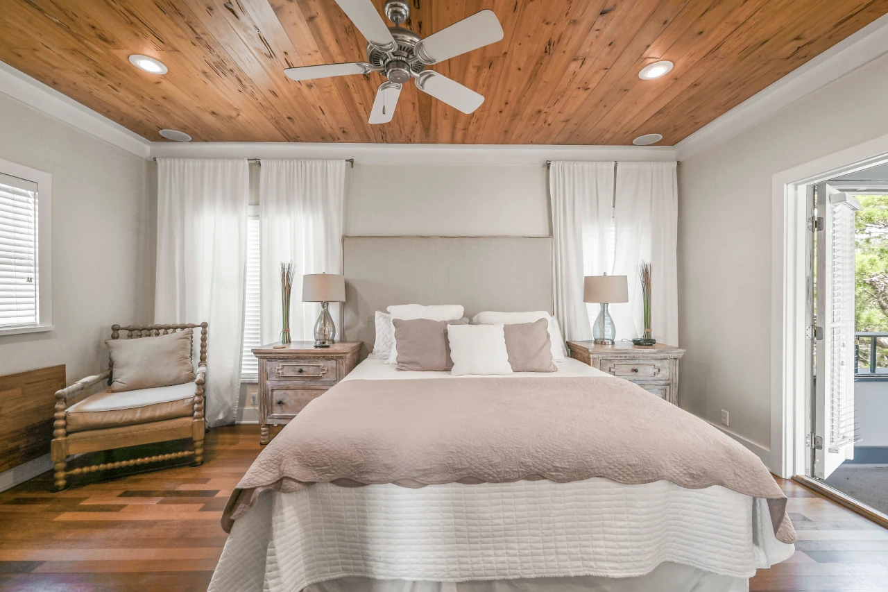 Master Suite Showing Kind Bed, Porch Door, and Murphy Desk