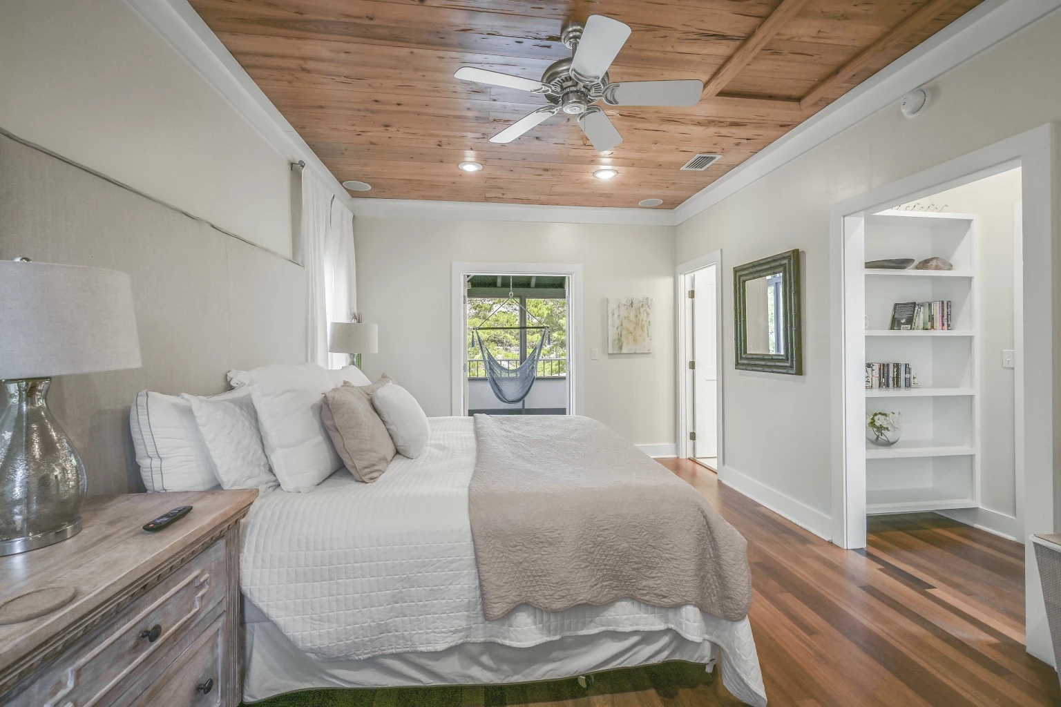 Looking Out the Master Suite Porch Door across the King Sized Bed Upstairs