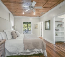 Looking Out the Master Suite Porch Door across the King Sized Bed Upstairs