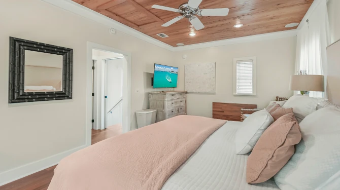 Master Suite Looking over King Size Bed at TV and Murphy Desk